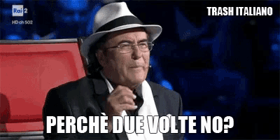 a man wearing a hat and glasses says perche due volte no ?