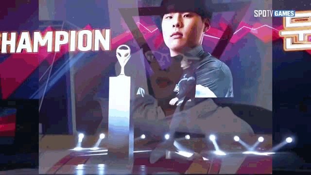 a man holding a trophy in front of a screen that says champion