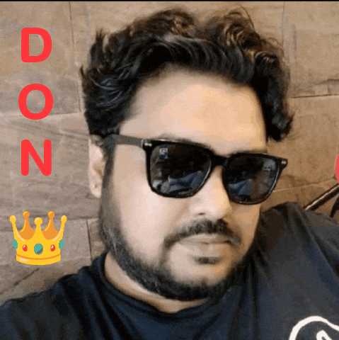 a man with a beard wearing sunglasses and a black shirt with the letters d on it
