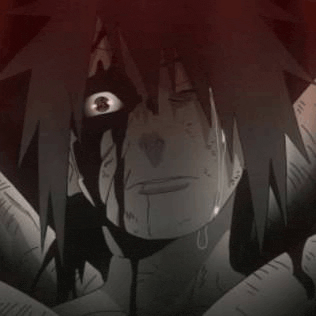 a close up of a person 's face with a bloody eye and a tear coming out of it .