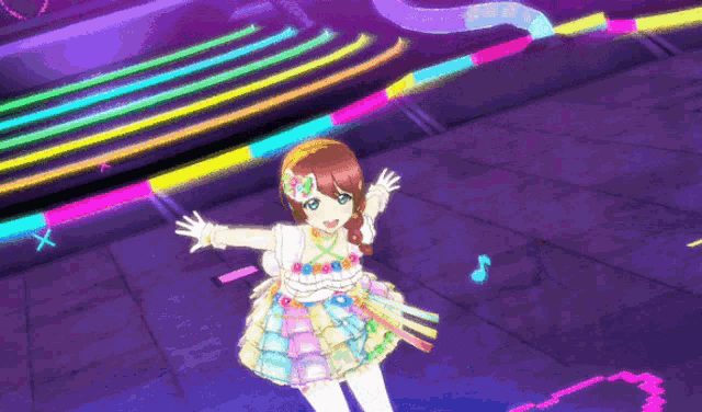 a girl in a colorful dress is standing on a stage with her arms outstretched