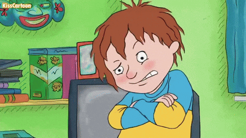 a cartoon of a boy sitting in front of a television with the words kisscartoon on the bottom right