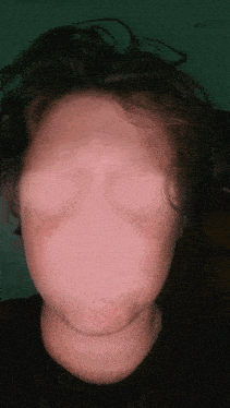a person with their eyes closed has a very large face
