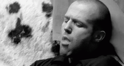 Blowing Smoke - Jason Statham GIF - Jason Statham Smoke Blowing Smoke GIFs