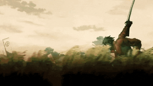 a man is holding a sword in a field .