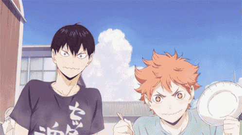 two anime characters are standing next to each other and one of them is wearing a black shirt with chinese writing on it