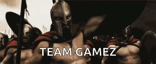 a man in a spartan helmet is standing in front of a group of soldiers with the words team gamez written below him