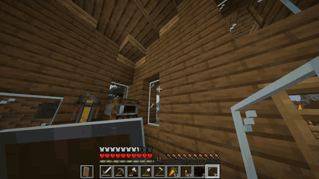 a screenshot of a minecraft game shows a house with a few items
