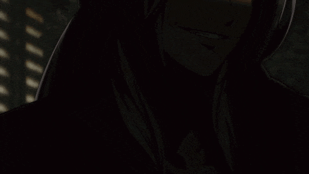 a close up of a person 's face with a dark background