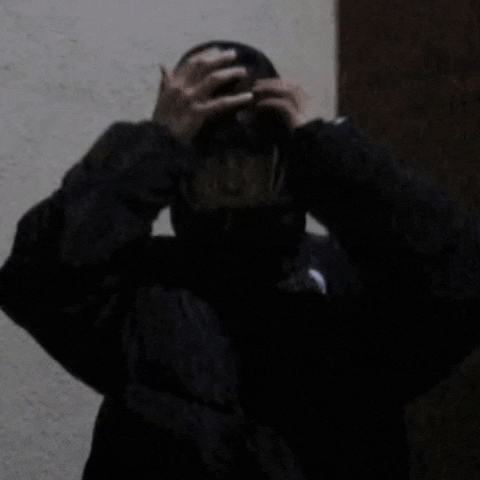 a person wearing a black jacket with the north face logo on the sleeve