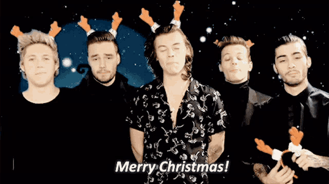 a group of men standing next to each other with the words merry christmas on the bottom right