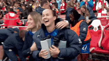 a woman wearing a blue jacket with the number 41 on it