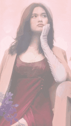 a woman wearing glasses and white gloves is surrounded by yellow flowers