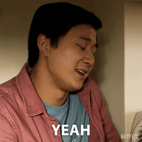 a man in a pink shirt says " yeah " in front of a netflix ad