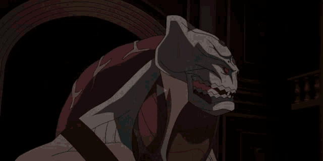 a cartoon monster with red eyes is sitting in a chair
