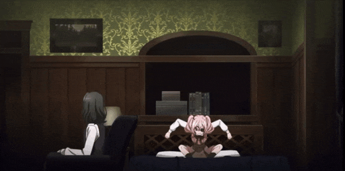 a girl in a pink dress is standing in a room with a woman sitting in a chair