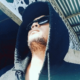 a man wearing sunglasses and a black hoodie