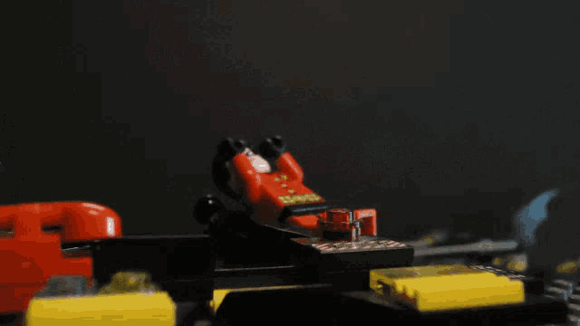 a lego figure with a red shirt that says ' sling ' on it