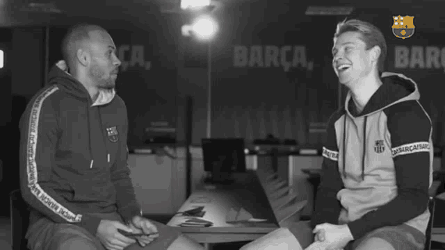 a man wearing a sweatshirt that says barca on the sleeve