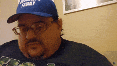 a man wearing glasses and a hat that says " family "