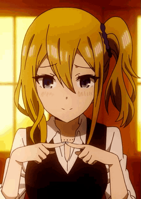 a girl with blonde hair is making a funny face with her hands