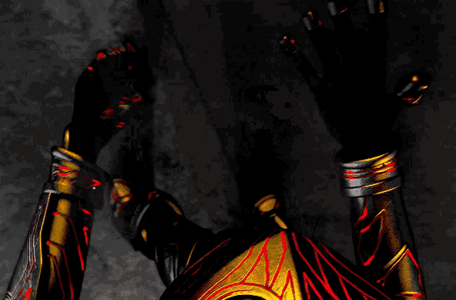 a person in a black and gold costume has their hands up