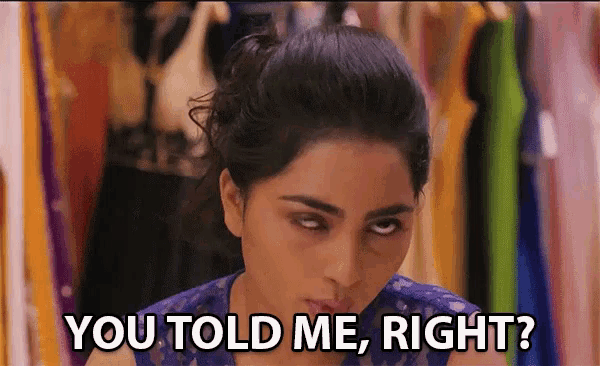 a woman says you told me right in front of a row of clothes