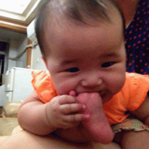 Baby Bites Toe Baby GIF - Baby Bites Toe Baby Bite Foot GIFs