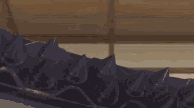 a blurry picture of a flame coming out of a candle