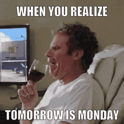 a man is sitting in a chair drinking a glass of wine with the caption when you realize tomorrow is monday ..