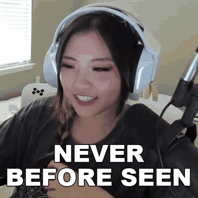 a woman wearing headphones with the words never before seen above her