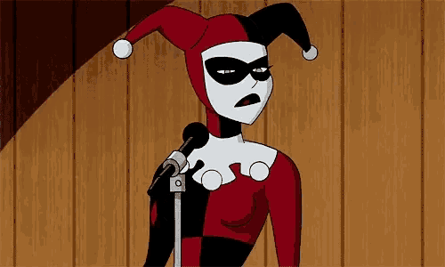 harley quinn is giving a speech in front of a microphone .