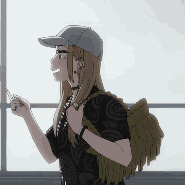 a girl wearing a hat and a black shirt has a tattoo on her ear