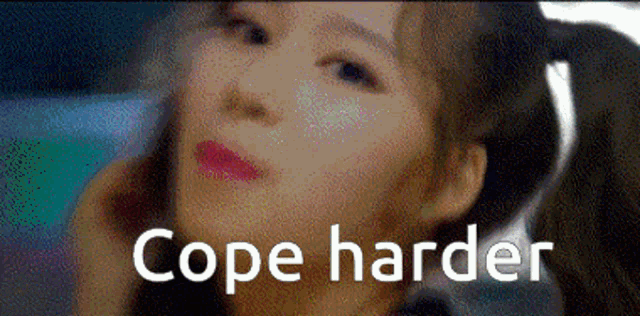 a close up of a woman 's face with the words `` cope harder '' written on it .