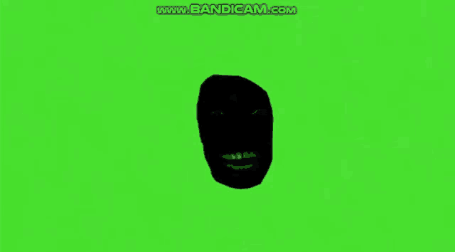 a silhouette of a black face on a green screen .