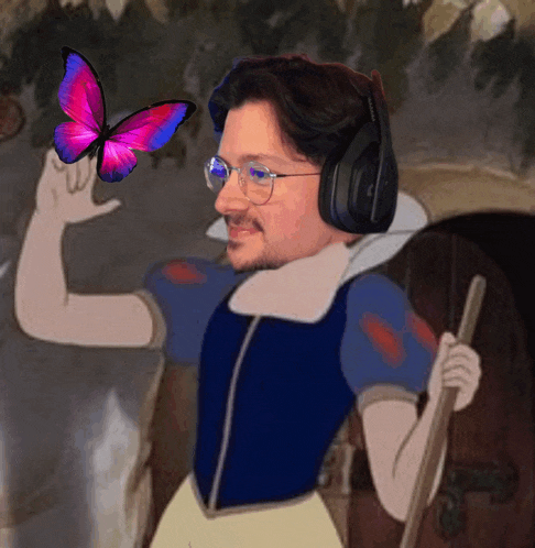 a man wearing headphones and glasses is holding a butterfly