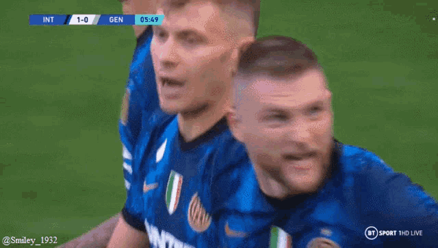 a group of soccer players are celebrating a goal during a game on bt sport