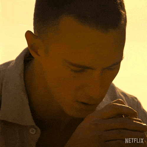 a close up of a man 's face with netflix written on the bottom right
