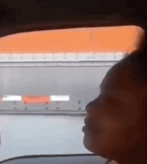 a close up of a person looking out a window