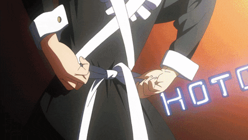 a person is tying a white tie and the word hot is visible in the background