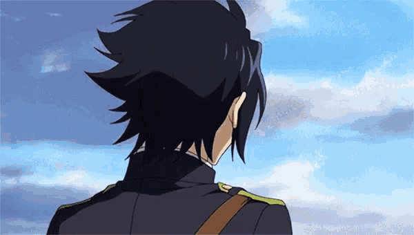 a man with long black hair is looking at the sky .
