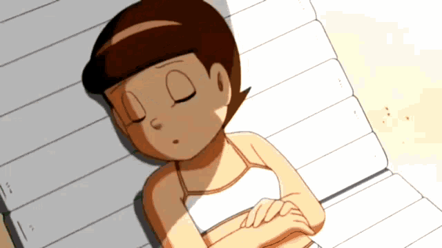 a girl in a white tank top is sleeping on a wooden bench
