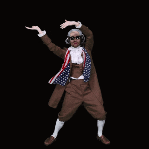 a man in a brown suit with an american flag scarf