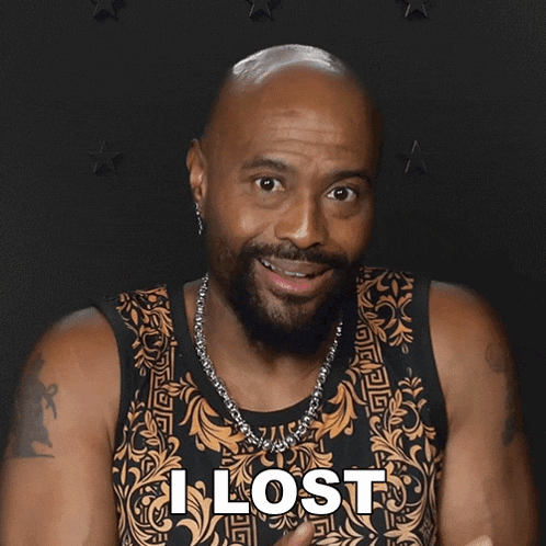 a bald man with a beard wearing a tank top that says i lost