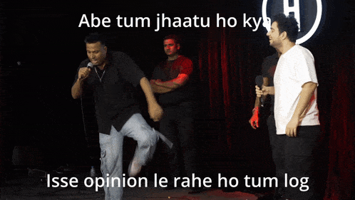 a group of men are standing around a table that says india 's got talent on it