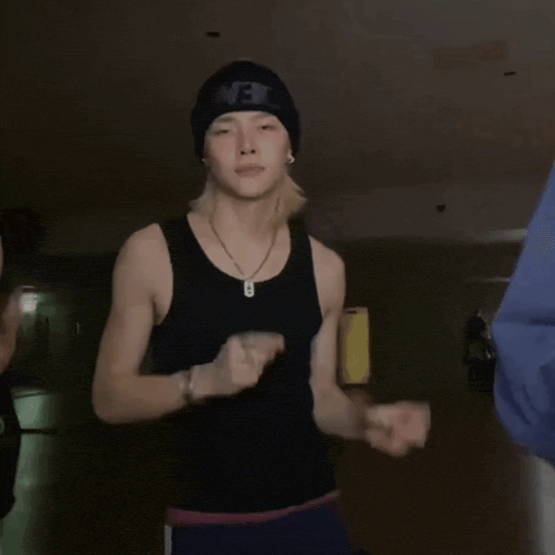 a man in a black tank top and a beanie with the word jet on it