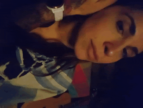 a close up of a woman 's face with a man 's face behind her