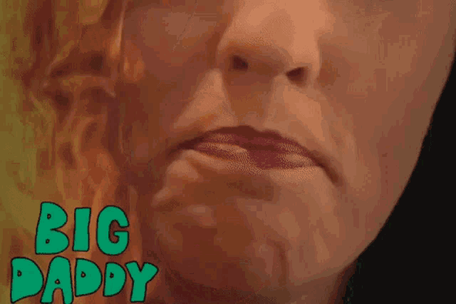 a close up of a woman 's face with the words big daddy written in green letters .