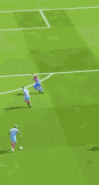 a soccer game is being played on a field with a banner that says sportsfi on it