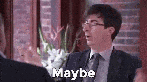 a man in a suit and tie is talking to another man and says `` maybe '' .